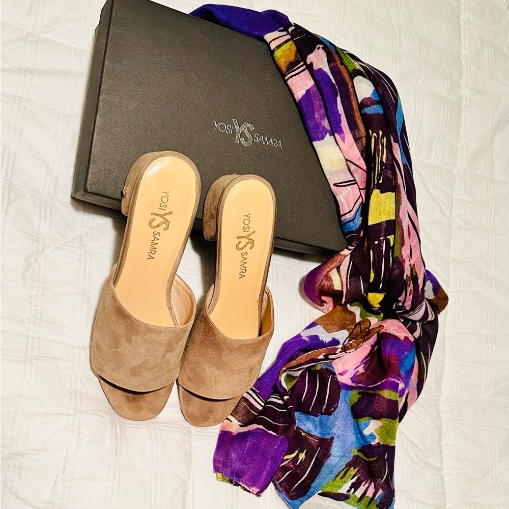 Beautiful tan slip on sandal, never worn in original box without tags.